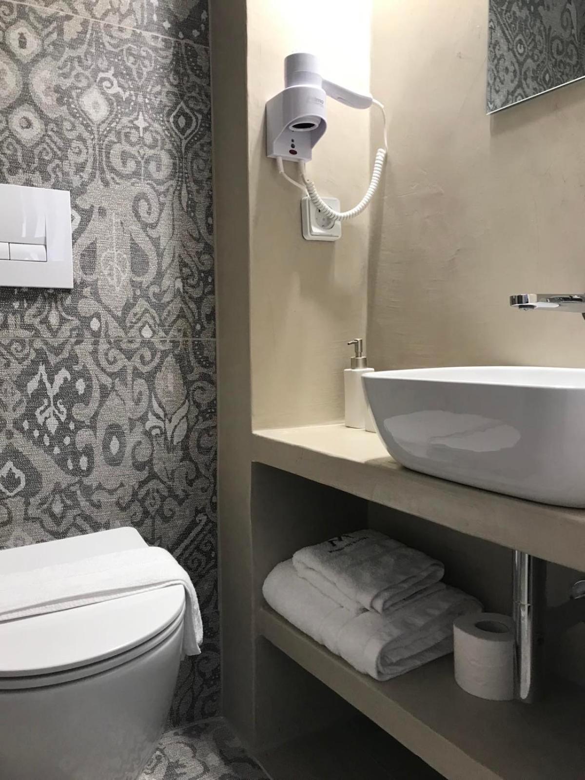 Morpheus Rooms Kini Esterno foto